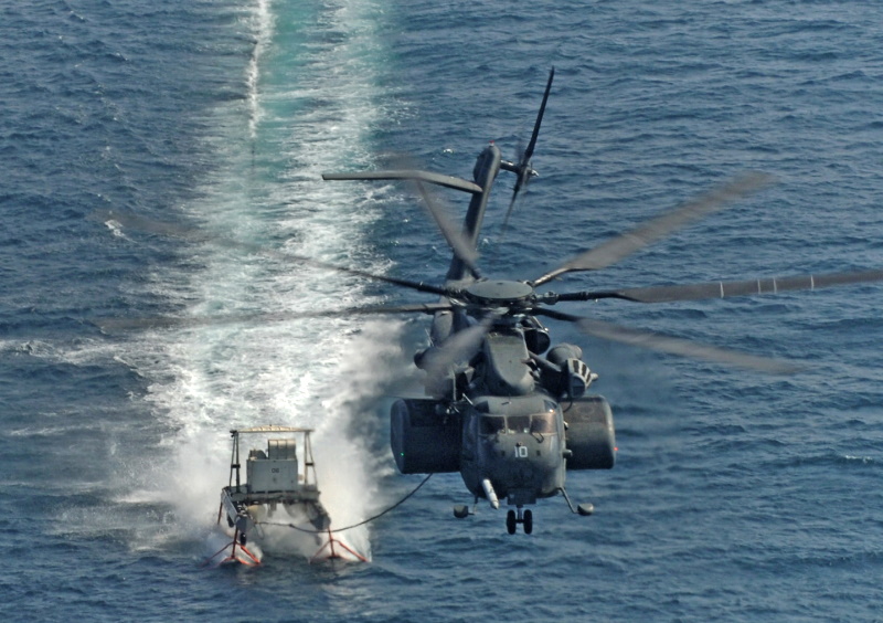 MH-53E towing mine-sweeping sled